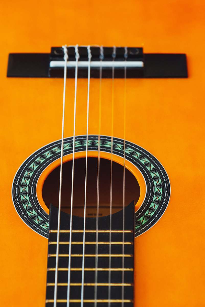 leisure activities brown acoustic guitar in close up photography musical instrument
